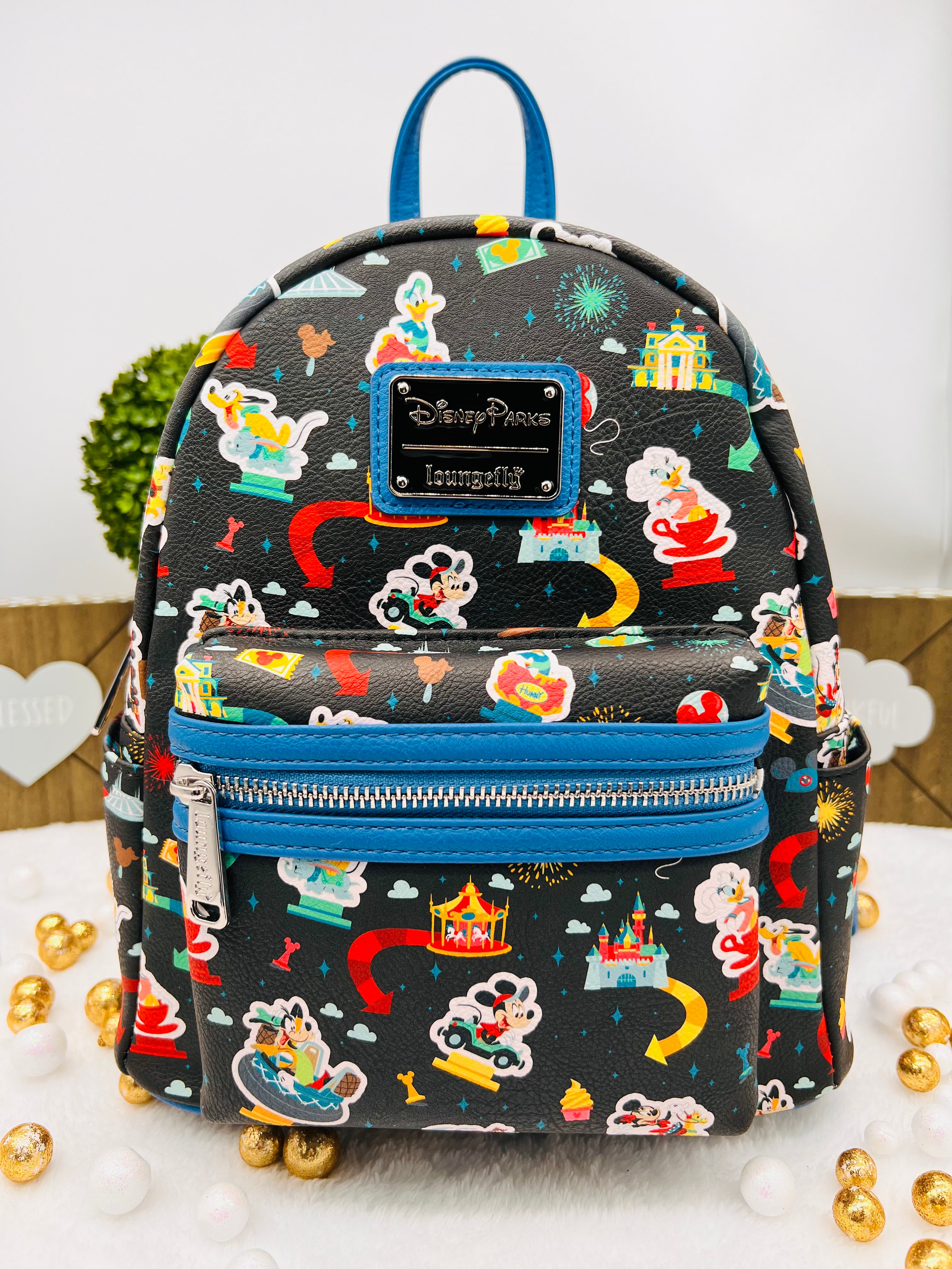 disney parks icons mini backpack by loungefly DLR - Icon the vibrant design is finished with multiple pockets and a double zip fastening. Loungefly Disney Parks Disneyland Ride